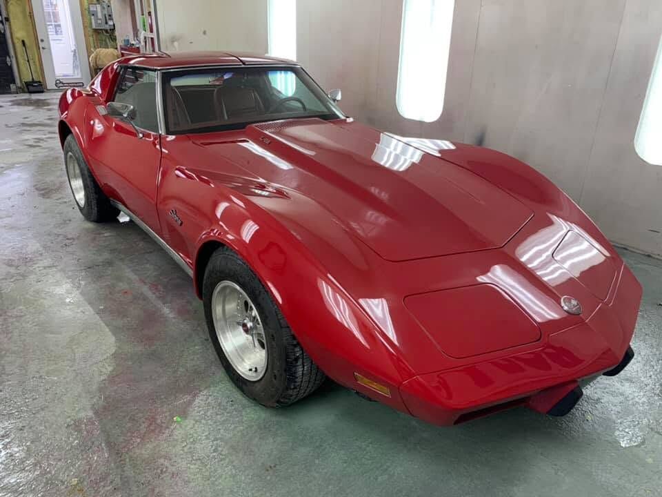 Red Corvette in the spray booth
